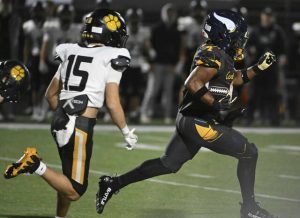 Central Catholic’s Jayden Alexander runs back the opening kick for a touchdown against North Allegheny during the WPIAL 6A football championship game Saturday.