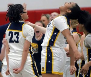 Karis Thomas, left, and Leah Burford, right, celebrate following the end of Shady Side Academy’s 43-29 win over OLSH in the PIAA semifinals last season.