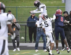 Aliquippa’s Qa’Lil Goode breaks up a pass intended for McKeesport’s Javien Robinson during the WPIAL Class 4A championship game Saturday at Pine-Richland.