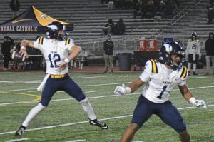 Central Catholic quarterback Owen Herrick throws a touchdown pass against State College in the first quarter of a PIAA Class 6A quarterfinal Friday, Nov. 21, 2025.