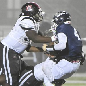 Aliquippa’s Mylez Greene finishes off a Quips sack of Oil City quarterback Cole Findlay during their PIAA Class 4A state quarterfinal on Friday, Nov. 21, 2025, at Slippery Rock University.