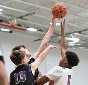 Jeannette’s Markus McGowan scores over OLSH’s Tiernan McCullough during a WPIAL Class 2A quarterfinal last season.