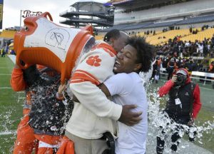 Clairton coach Wayne Wade gets the water cooler shower after beating Laurel in the WPIAL Class A football championship game Saturday at Acrisure Stadium.