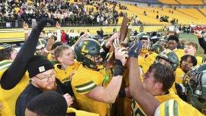 Seton LaSalle celebrates with the trophy after beating Steel Valley during the WPIAL Class 2A football championship game Saturday at Acrisure Stadium.