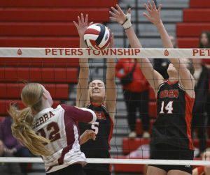Eden Christian Academy’s Kylie Polard (5), alongside Emily Muir (14), blocks the shot of Serra Catholic’s Ryleigh Carper during the WPIAL Class A volleyball championship Nov. 1 at Peters Township High School.
