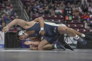 Kiski Area’s Cooper Roscosky wrestles Belle Vernon’s Elijah Brown in the 215-pounds championship match during the PIAA Class 3A tournament last season.