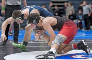 Elizabeth Forward’s Lucas Boyer (right) grabs the leg of Knoch’s Owen Layhew in the 145-pound finals at the WPIAL Class 2A championships Saturday, Feb. 22, 2025.