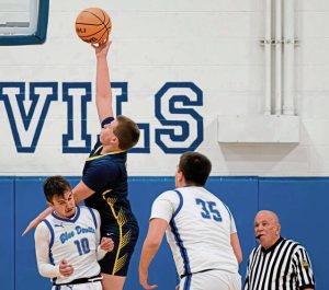 Apollo-Ridge’s Brayden Myers scores over Leechburg’s Rocco Vigna (10) on Friday at Leechburg.