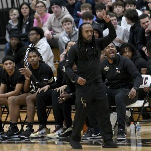 Imani Christian head coach Khayree Wilson motions from the bench during a game against Upper St. Clair on Tuesday, Jan. 7, 2024, at USC.