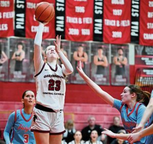 Greensburg Central Catholic’s Erica Gribble scores over Cambria Heights’ Gracey Vinglish during a PIAA Class 3A first-round game March 7.