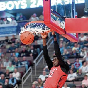 Sewickley Academy’s Adam Ikamba dunks against Linville Hill during the PIAA Class 2A championship game March 28 at Giant Center in Hershey.