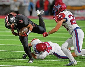 Southmoreland’s Jackson Mickens gets past Mt. Pleasant’s Stephen Predajna during a game in October. Mickens had 11 total touchdowns this season.