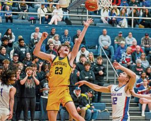 Thomas Jefferson’s Nick Trklja takes a shot in front of Chartiers Valley’s Julian Semplice during a WPIAL Class 5A first-round playoff game Feb. 18.