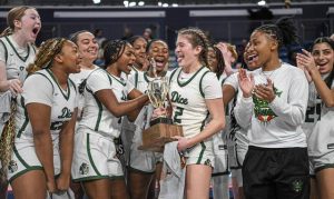 Allderdice’s Bailey White (2) reacts after being named most valuable player of the 2025 City League girls basketball championship game while surrounded by her teammates Sunday, Feb. 16, 2025, at UPMC Cooper Fieldhouse.