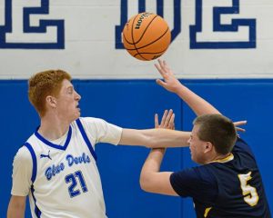 Apollo-Ridge's Brayden Myers (5) is fouled by Leechburg's Mason Bertino (21) on Friday, Nov. 28, 2025, at Leechburg.