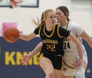 Thomas Jefferson’s Maggie Spell handles the ball as Penn-Trafford’s Torrie DeStefano defends in the WPIAL Class 5A quarterfinals Feb. 19.