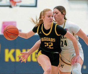Thomas Jefferson’s Maggie Spell handles the ball as Penn-Trafford’s Torrie DeStefano defends in the WPIAL Class 5A quarterfinals Wednesday, Feb. 19, 2025.