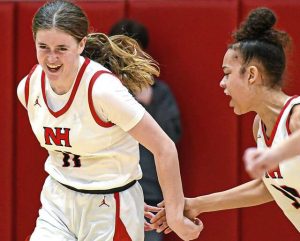 North Hills’ Delaney Amato (left) is congratulated by Gianna Sturdivant following a 3-point basket Feb. 20, 2024.