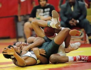 Penn Hills wrestler Daemon Phipps tilts Allderdice’s Caleb Mcfarlane during the 114-pound match Dec. 28, 2024, at the Penn Hills Holiday tournament.