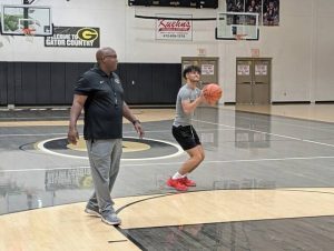 Gateway coach Vern Benson works with Jax Vovaris during an open-gym workout Sept. 30 at Gateway’s Furrie Sports Complex.