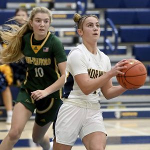 Norwin’s Nia O’Barto scores past Penn-Trafford’s Olivia Weishaar during their game on Dec. 2, 2025, at Norwin. (Christopher Horner | TribLive)