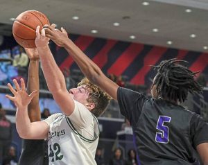 Allderdice’s Lukas Stead (42) is fouled by Obama Academy’s Darnell Clay (5) during the 2025 City League boys basketball championship game Feb. 16 at UPMC Cooper Fieldhouse. (Andrew Palla | For TribLive)