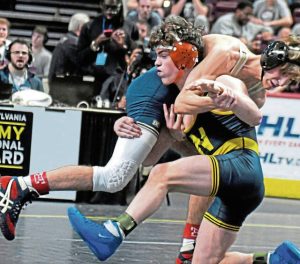 Norwin’s Landon Sidun records a takedown in the 2024 PIAA championship against Ridley’s Curtis Nelson. (Paul Schofield | TribLive)