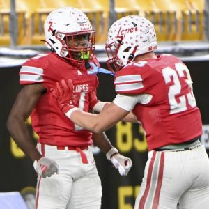 Avonworth’s Romello Harris celebrates his pick-six against Imani Christian with Bryce Metz during the WPIAL Class 3A championship game Nov. 22 at Acrisure Stadium. (Christopher Horner | TribLive)