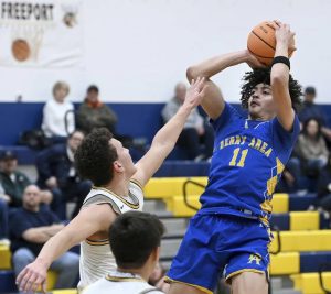 Derry’s Stanley Rajkovich scores over Freeport’s Danny King during their game on Wednesday at Freeport. (Christopher Horner | TribLive)