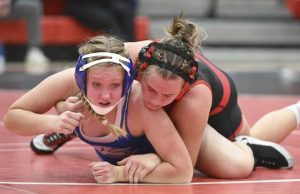Fox Chapel’s Lauren Bachman wrestles Hampton’s Sydney Pacek in the 148-pound bout Wednesday, Dec. 3, 2025 at Fox Chapel Area High School. (Chaz Palla | TribLive)