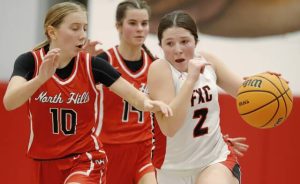 Fox Chapel’s Bailey Sacco charges downcourt past North Hills’ Zoe Devilin during a nonsection game Tuesday, Dec. 2, 2025. (Josh Rizzo | For TribLive)