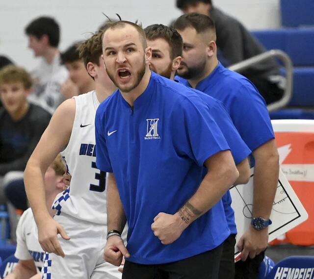 Hempfield head coach Austin Butler reacts on the bench during the Spartans’ game against Latrobe on Thursday, Dec. 4, 2025, at Hempfield. (Christopher Horner | TribLive)