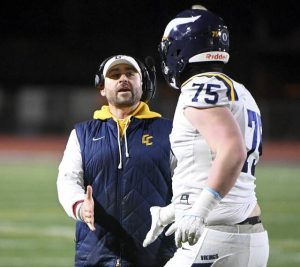 Central Catholic head coach Ryan Lehmeier celebrates with Jon Sassic after scoring against Harrisburg during their PIAA Class 6A semifinal on Saturday, Nov. 29, 2025, at Mansion Park in Altoona. (Christopher Horner | TribLive)