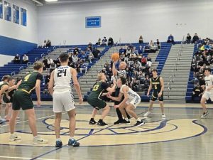 Referee Mike Gaffney throws up the jump ball for Friday night’s boys basketball game between 
Penn-Trafford and Hempfield in the Hempfield Tip-off Tournament. (Bill Beckner Jr. | TribLive)