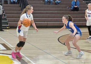 Mt. Pleasant's Danica Trainer is guarded by Hempfield's Olivia Eiseman on Friday, Dec. 5, 2025, at Greensburg Salem High School. (Dave Mackall | For TribLive)