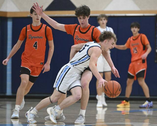 Burrell’s Adam Wass is fouled by Springdale’s Wes Hickman on Friday at Burrell High School. (Chaz Palla | TribLive)