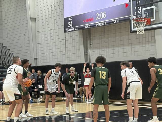 Upper St. Clair’s Ryan Robbins shoots a free throw against Belle Vernon on Friday. (Don Rebel | TribLive)