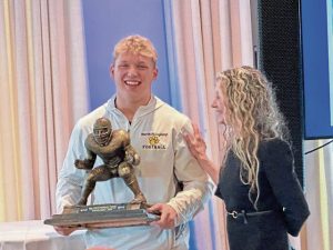 North Allegheny’s Lincoln Hoke receives the Bill Fralic Award from Susan Fralic, the widow of the former Pitt and NFL lineman for whom the award is named. (Antonio Rossetti | For TribLive)