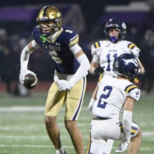 La Salle College’s Joey O’Brien celebrates after making a one-handed catch next to Central Catholic’s Zach Gleason during the PIAA Class 6A state championship game on Saturday, Dec. 6, 2025, at Cumberland Valley. (Christopher Horner | TribLive)