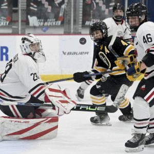 Moon goalie Tyler Zeigler makes a save on Quaker Valley’s Max Modrovich during their game on Monday, Nov. 24, 2025, at RMU Island Sports Center. (Christopher Horner | TribLive)
