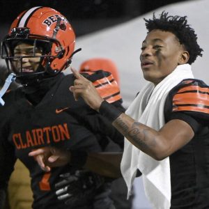 Clairton quarterback Jeff Thompson celebrates with Tahvaz Armstrong as time winds down in the Bears’ PIAA Class A semifinal against Greenville on Friday, Nov. 28, 2025, at Helling Stadium in Ellwood City. (Christopher Horner | TribLive)