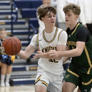 Norwin’s King Carver works against Penn-Trafford’s Nick Ponko on Dec. 2 at Norwin. (Christopher Horner | TribLive)