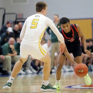 Josh Pratt, playing for Aliquippa last season, attempts to push past Forest Hills’ Dylan Stohon in a PIAA Class 3A quarterfinal. (Josh Rizzo | For TribLive)