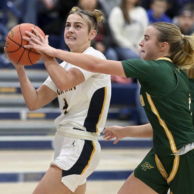 Norwin’s Nia O’Barto drives past Penn-Trafford’s Izzie Fontana on Dec. 2. (Christopher Horner | TribLive)