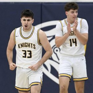 Norwin’s Stef Giannikas celebrates next to Josh Lenart during their game against Penn-Trafford on Dec. 2. (Christopher Horner | TribLive)