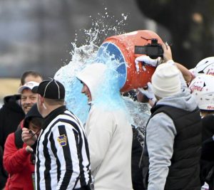 Avonworth coach Duke Johncour gets doused with the Gatorade cooler as time expires in the PIAA Class 3A championship game against Northwestern Lehigh on Saturday at Cumberland Valley. (Christopher Horner | TribLive)