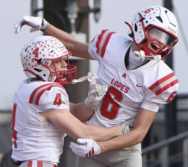Avonworth’s Jaden Jones (6) celebrates with Luca Neal after scoring against Northwestern Lehigh during the PIAA Class 3A championship game Saturday at Cumberland Valley. (Christopher Horner | TribLive)