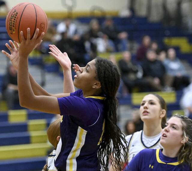 Plum’s Tamia West scores against Kiski Area on Monday. (Christopher Horner | TribLive)