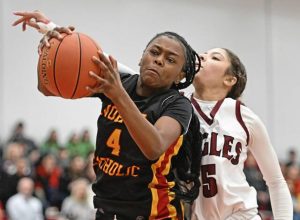 North Catholic’s Harmony Jones grabs a rebound from Oakland Catholic’s Savanna Daye during a WPIAL Class 3A semifinal last season. (Chaz Palla | TribLive)