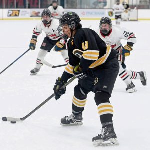 Quaker Valley’s Matthias Lezama works toward the goal past Moon defenders on Monday, Nov. 24, 2025, at RMU Island Sports Center. (Christopher Horner | TribLive)